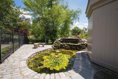 The water fountain has water lilies and fish.