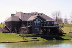 Brick & Stone Exterior, Decks and Patio's overlook the sparkling lakeview.