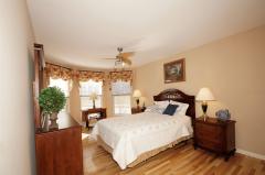 A charming Bay window enhances this beautiful second bedroom.