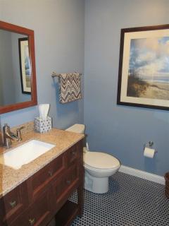 1/2 bath in basement. Beautiful mosaic tile work.