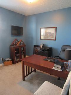 6th bedroom is located on the 1st floor and currently being used as an office.