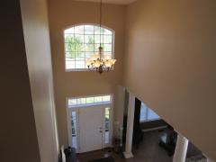 2 story entry with large window and chandelier