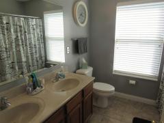 2nd full bath upstairs features double sinks and ceramic tile floors.