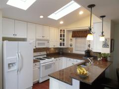 The kitchen also has wood flooring, plenty of natural light from multiple windows and sky lights, granite tops, stone back splash, modern appliance all included.
