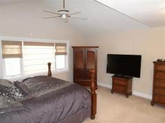 Comfortable master bedroom with large windows. Imagine on nice summer evenings, open up the windows and fall asleep to the relaxing sound of the fountain outside.