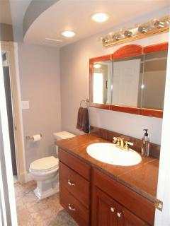 Tile, granite, high end fixtures, plenty of lighting.