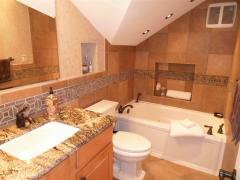 Tile, granite, stone, accent lighting adjustable, high end fixtures, jaccuzi tub.