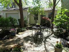 Back yard is protected by automatic security gate, remote controlled. Entry to kitchen, patio next to Koi pond with waterfall, oversized garage. Plenty of room for parking as well.