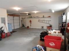 This is a tremendous garage with room for multiple vehicles and storage above. It is finished and painted.