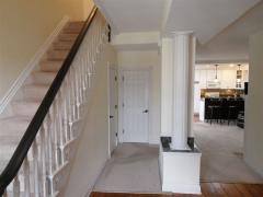 The front entrance foyer opens up into the dining room. Further down is a half bath, living room, and kitchen. A very functional floor plan that is difficult to find in a historic home such as this one.