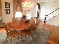 Formal Dining Room for Entertaining. Fireplace and two large windows.