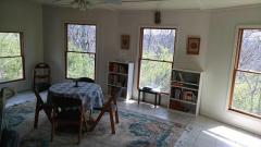 Large solarium with tile flooring, wood windows and door to deck. Great for entertaining!