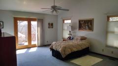 Huge Master Suite with sliders to deck, walkin closet, dressing area, encompasses one end of home.
