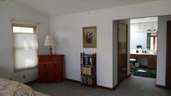 Cathedral master suite with walkin closet and custom bath.