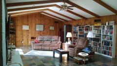 Great Room with woodburning fireplace, Glass doors, hickory wood walls, beams, cathedral ceilings on most of main level. Newer Andersen sliding doors (3 sets)and the view!