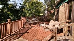 Rebuilt deck and restained in last couple years, extra supports added. A rustic lot with views of woods out most windows. An acre of wooded land and has dropoff behind home, THREE car side entry garage. Newer mechanics, roof,HVAC,drive, and more!