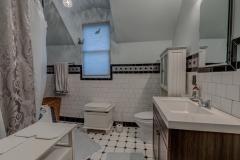 Ceramic Tile Master Bath with Whirlpool/Jetted tub, rain shower head and vanity. Charm!