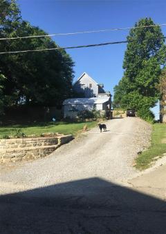 Turn on Widrig Street which brings you to the back of the house / driveway
