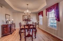 Formal Dining for those special dinner parties. Custom drapes, beautiful hardwood floors. Faux painting on walls.