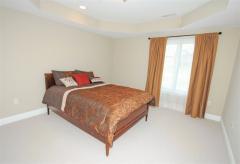 Third bedroom has tray ceiling and oversized window
