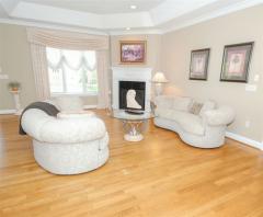 Living room boasts coffered ceiling