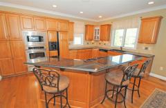 Kitchen has double oven and warming drawer