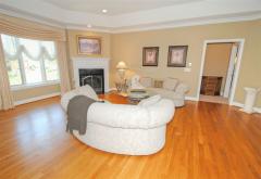 Living room offers triple view windows and recessed lighting