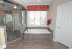 Designer bath has relaxing jetted tub