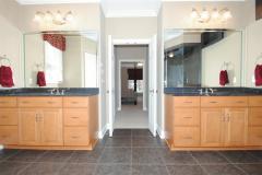 Beautiful double vanity and flat screen TV is part of master suite