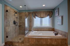 ...frameless shower and Italian porcelain tile!