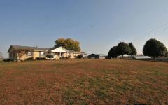 Bring your horses! 2 metal barns 38x60 & 40x60 with full lofts, electric & water! 1 Horse barn with 3 stalls and additional space for potentially more stalls, tack room, & heated water fountain. Large barn with storage area, workshop & cem