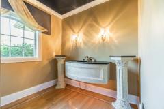 Half bath located in the entry hallway! Great detail work!
