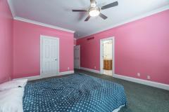Bedroom #2 with adjoining bathroom and access to bedroom #3! Abundant closet space, built in shelving, ceiling fan and more!