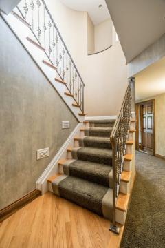 Gorgeous staircase with a curve! The detail adds so much character to this home! If you think you had enough living space already, just wait until you see the rest!