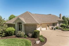 Side entry of the home with 3 car oversized attached garage! Also offering 2 detached garages!