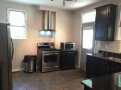 Gorgeous brand new kitchen with high end hood. Hardwood floors, granite counter tops and 42 inch Sarsaparillo colored cabinets.