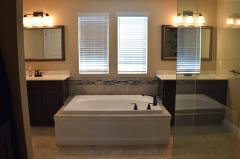 His and Her vanities and a soaking tub compliment the amazing shower in this master retreat!