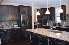 Stunning gourmet kitchen w/ granite counters, large island, 42 inch cabinets & more!