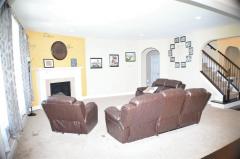 Great room is centered by the gas fireplace but opens to the kitchen and entry.