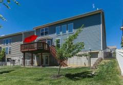 Rear Deck and Patio. Also rear mini garage door into a Storage Room.