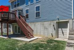 Rear Deck and Patio. Also rear mini garage door into a Storage Room.