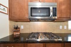 Upgrades like stainless gas top, spacesaver microwave and double ovens!