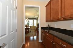 Conveniently located between the Formal Dining Room and Kitchen and opposite the walk-in Pantry closet.