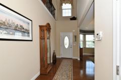 Two Story Foyer with Hardwood Floor and Leaded Glass Entry.