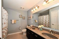 Tiled Floor, Double Vanity and Easy to Clean Tub/Shower.