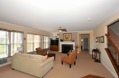 Totally open to the Chef's Kitchen, the Great Room boasts beautiful carpet, gas fireplace and a wall of windows!