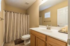 Master bath has tub/shower, satin nickel fixtures & custom blinds