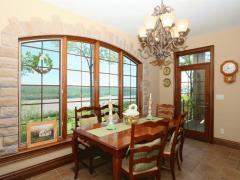 Eat in kitchen looks out onto expansive deck with views of the river.
