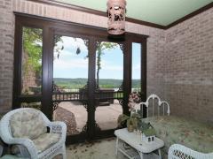 One of the lower level suites walks out to this screened in porch.