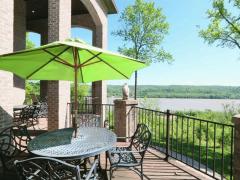 From the first level walk out onto this deck that spans the back of the home with endless Ohio River views.